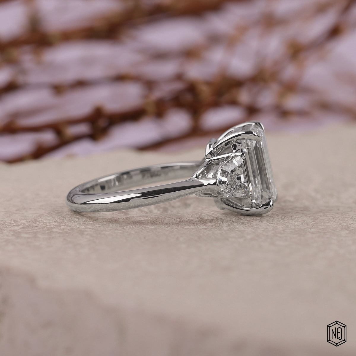 3.06 Carat Emerald Cut Lab Grown Diamond Trellis Three-Stone Engagement Ring - Side Profile Angle