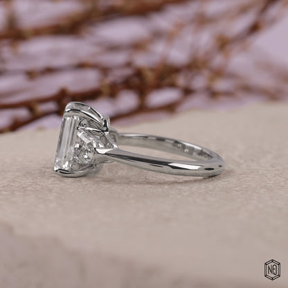 3.06 Carat Emerald Cut Lab Grown Diamond Trellis Three-Stone Engagement Ring - Angled Perspective