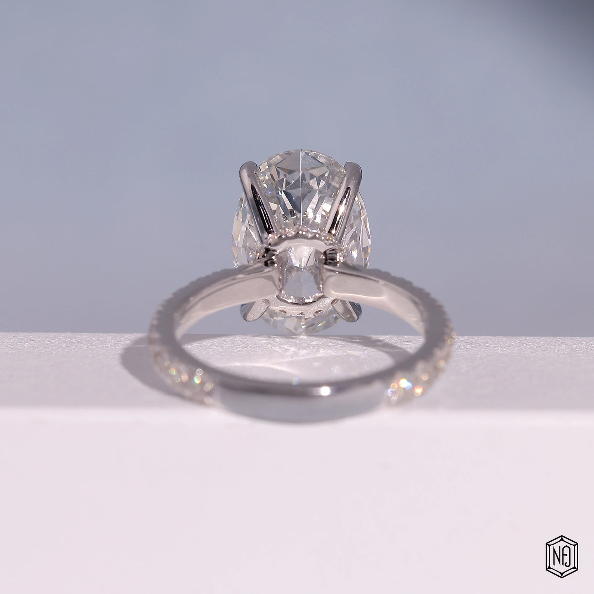 4.59 Carat Oval Cut Lab Grown Diamond Delicate Hidden Halo Engagement Ring - Hand View / Detail Angle
