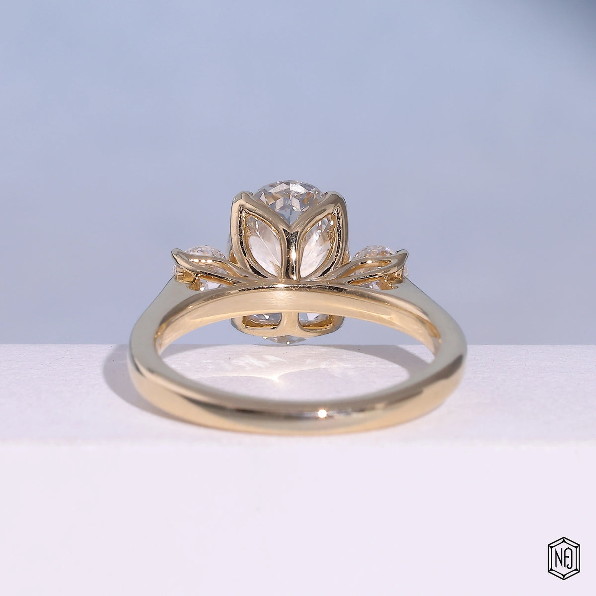 2.53 Carat Oval Cut Lab Grown Diamond Trellis Three-Stone Engagement Ring - Hand View / Detail Angle