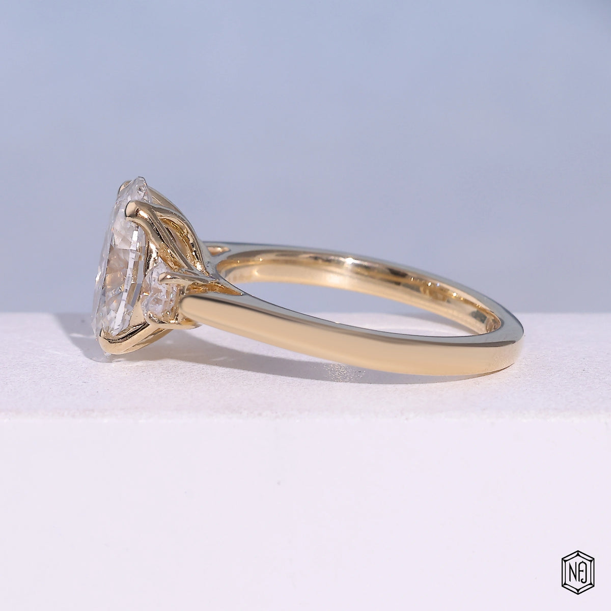 2.53 Carat Oval Cut Lab Grown Diamond Trellis Three-Stone Engagement Ring - Angled Perspective