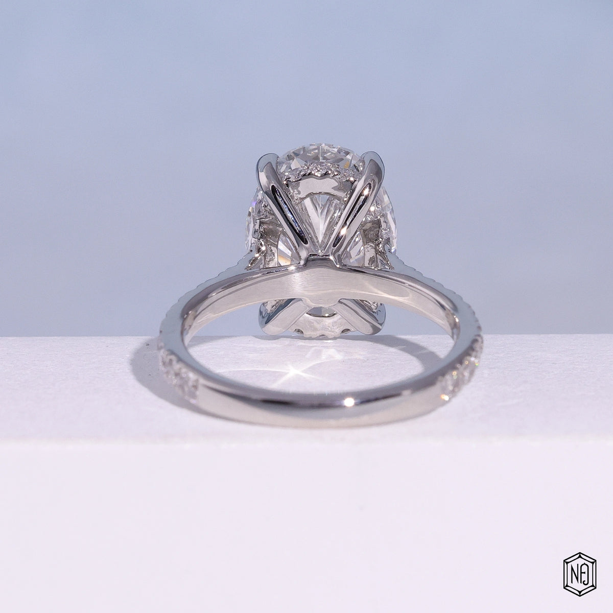 4.03 Carat Oval Cut Lab Grown Diamond Delicate Hidden Halo Engagement Ring - Hand View / Detail Angle