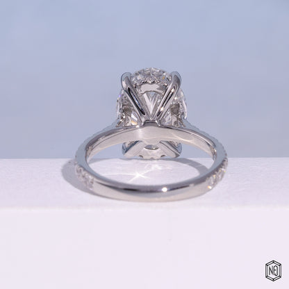 4.03 Carat Oval Cut Lab Grown Diamond Delicate Hidden Halo Engagement Ring - Hand View / Detail Angle