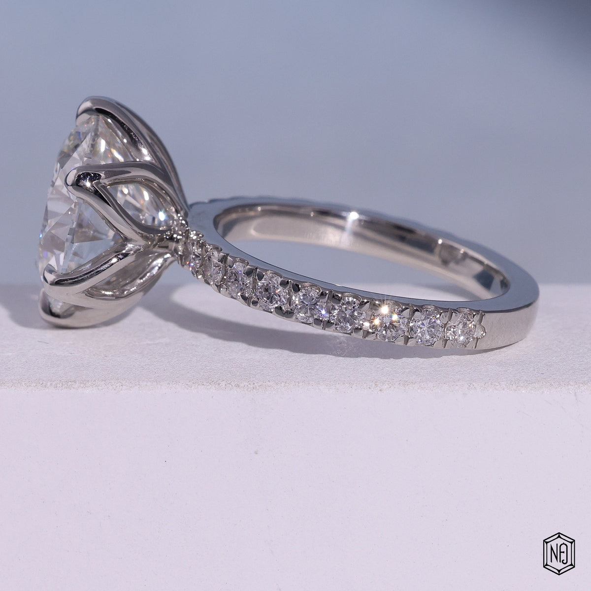 7.02 Carat Round Cut Lab Grown Diamond Side Stone Pavé Engagement Ring - Angled Perspective