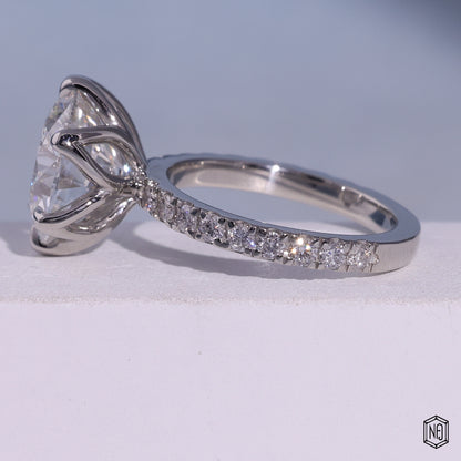 7.02 Carat Round Cut Lab Grown Diamond Side Stone Pavé Engagement Ring - Angled Perspective