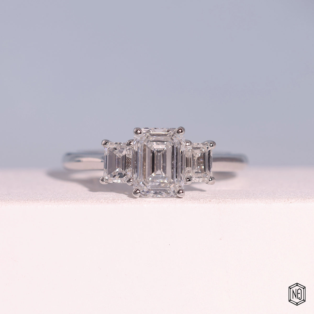 1.24 Carat Emerald Cut Lab Grown Diamond Trellis Three-Stone Engagement Ring - Front Top View