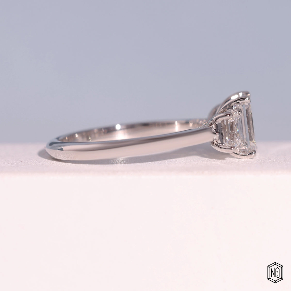 1.24 Carat Emerald Cut Lab Grown Diamond Trellis Three-Stone Engagement Ring - Side Profile Angle