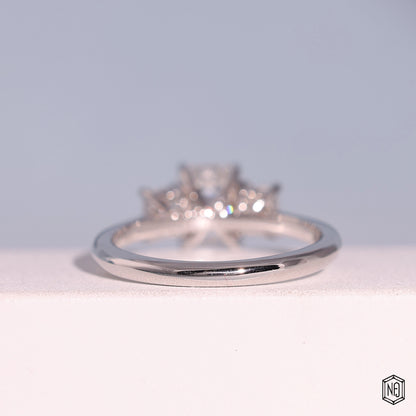 1.24 Carat Emerald Cut Lab Grown Diamond Trellis Three-Stone Engagement Ring - Hand View / Detail Angle