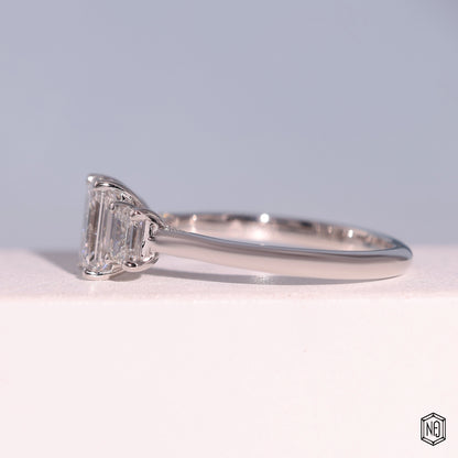 1.24 Carat Emerald Cut Lab Grown Diamond Trellis Three-Stone Engagement Ring - Angled Perspective