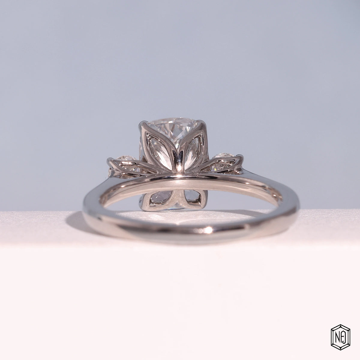 2.42 Carat Cushion Cut Lab Grown Diamond Trellis Three-Stone Engagement Ring - Hand View / Detail Angle