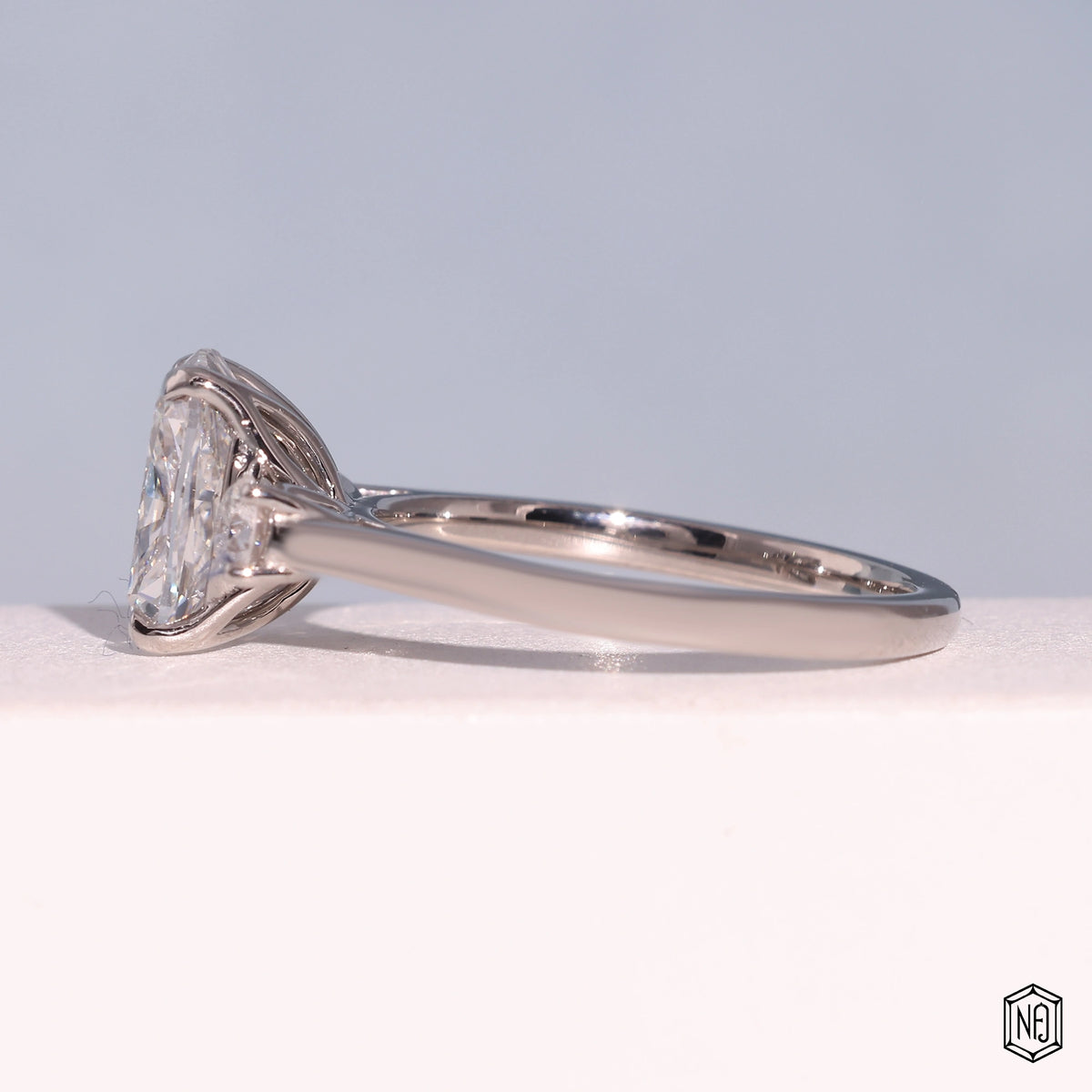 2.42 Carat Cushion Cut Lab Grown Diamond Trellis Three-Stone Engagement Ring - Angled Perspective