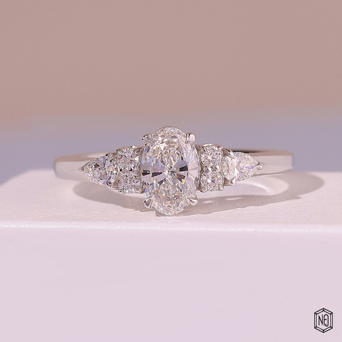 0.72 Carat Oval Cut Lab Grown Diamond Trellis Three-Stone Engagement Ring - Front Top View