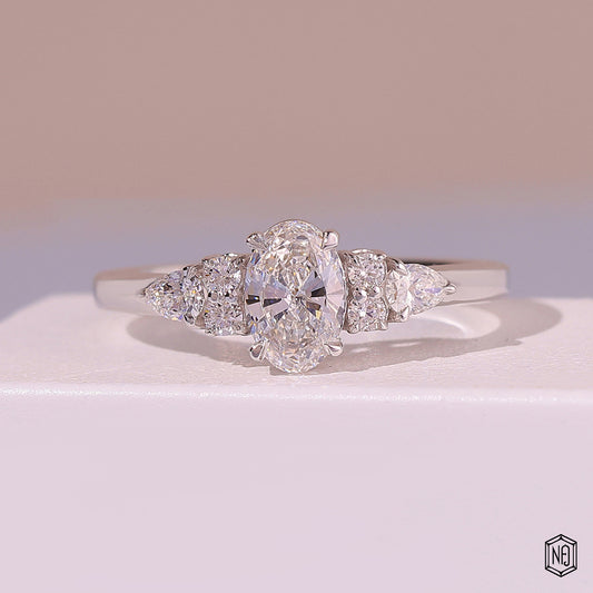 0.72 Carat Oval Cut Lab Grown Diamond Trellis Three-Stone Engagement Ring - Front Top View