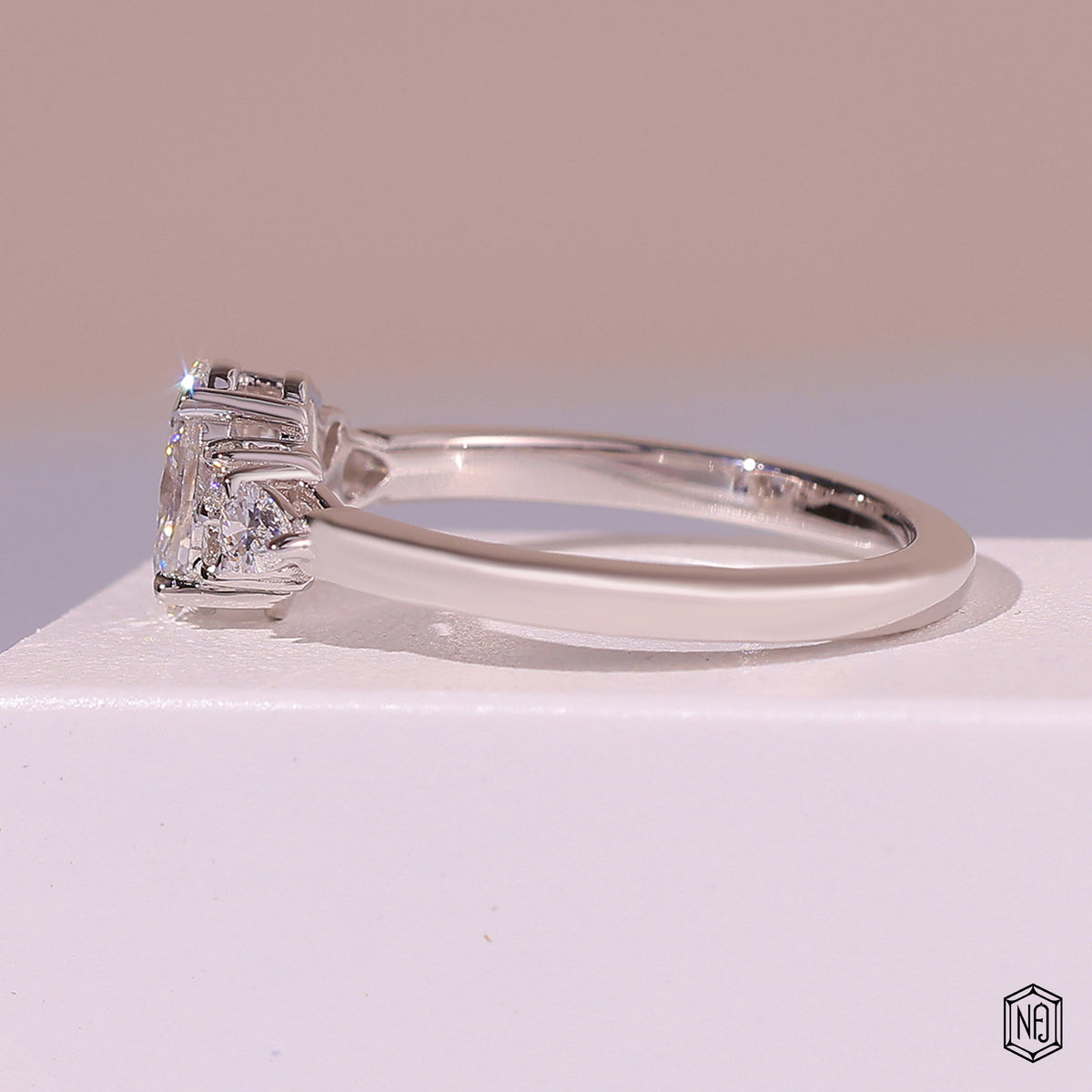 0.72 Carat Oval Cut Lab Grown Diamond Trellis Three-Stone Engagement Ring - Side Profile Angle