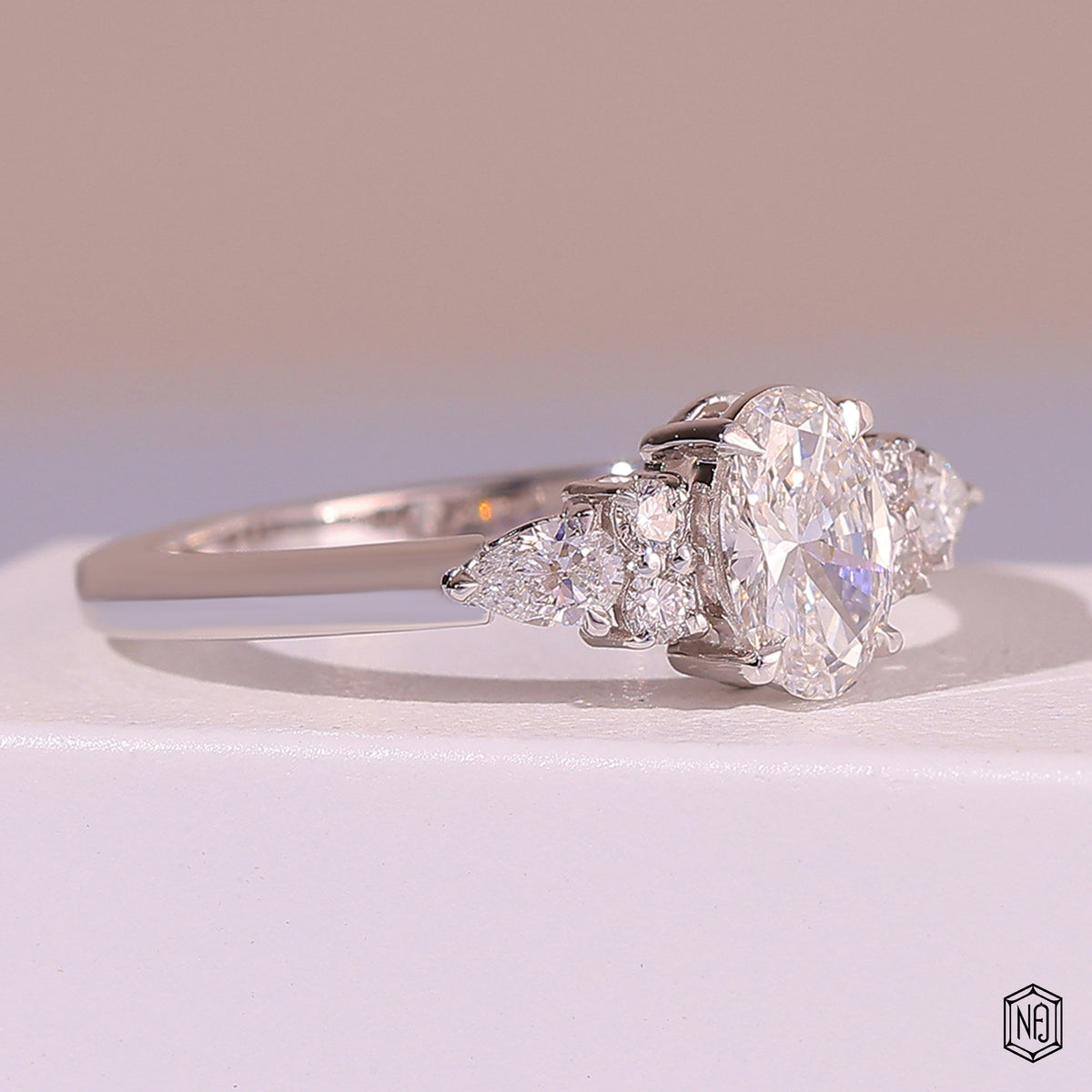 0.72 Carat Oval Cut Lab Grown Diamond Trellis Three-Stone Engagement Ring - Gallery & Prongs Detail