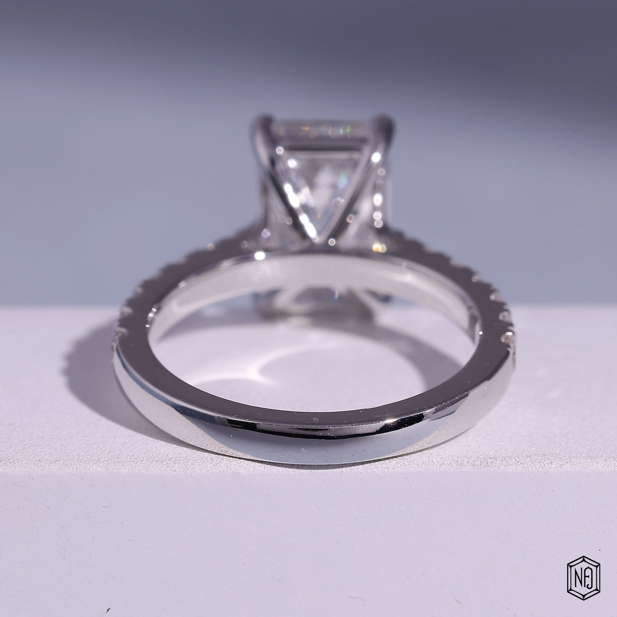 3.71 Carat Emerald Cut Lab Grown Diamond Side Stone Pavé Engagement Ring - Hand View / Detail Angle
