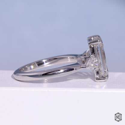 4.71 Carat Emerald Cut Lab Grown Diamond Trellis Three-Stone Engagement Ring - Side Profile Angle