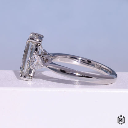 4.71 Carat Emerald Cut Lab Grown Diamond Trellis Three-Stone Engagement Ring - Angled Perspective