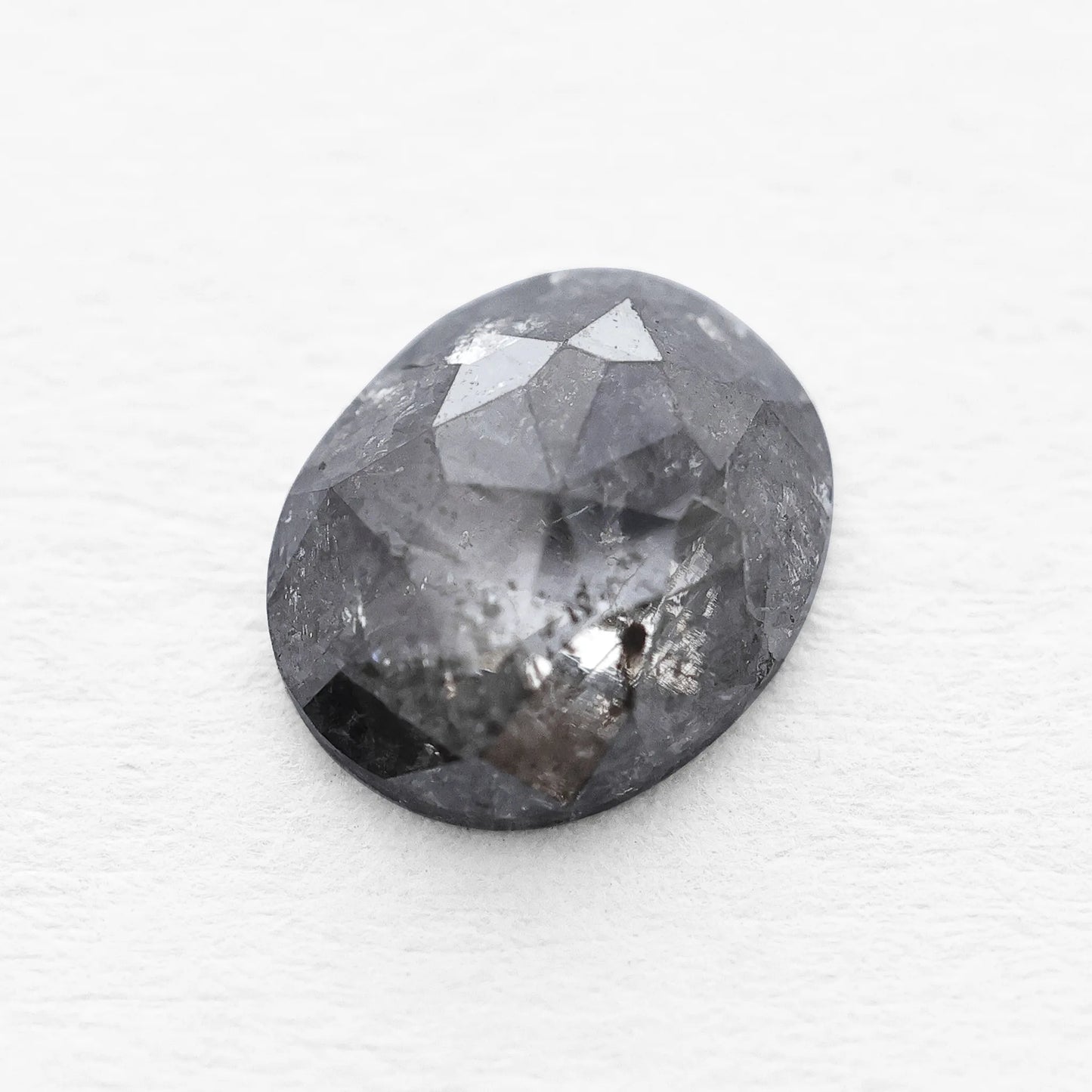 0.66 Ct Oval Cut / Facet Style Salt and Pepper Diamond