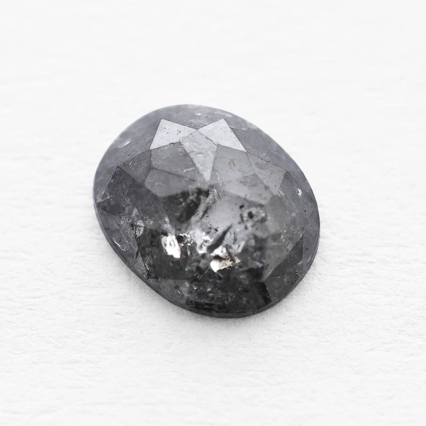 0.66 Ct Oval Cut / Facet Style Salt and Pepper Diamond