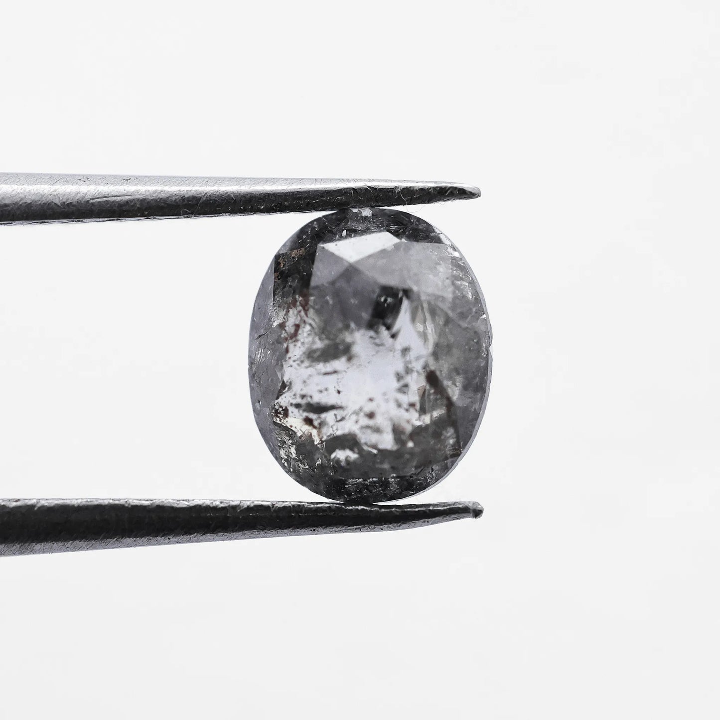 0.66 Ct Oval Cut / Facet Style Salt and Pepper Diamond
