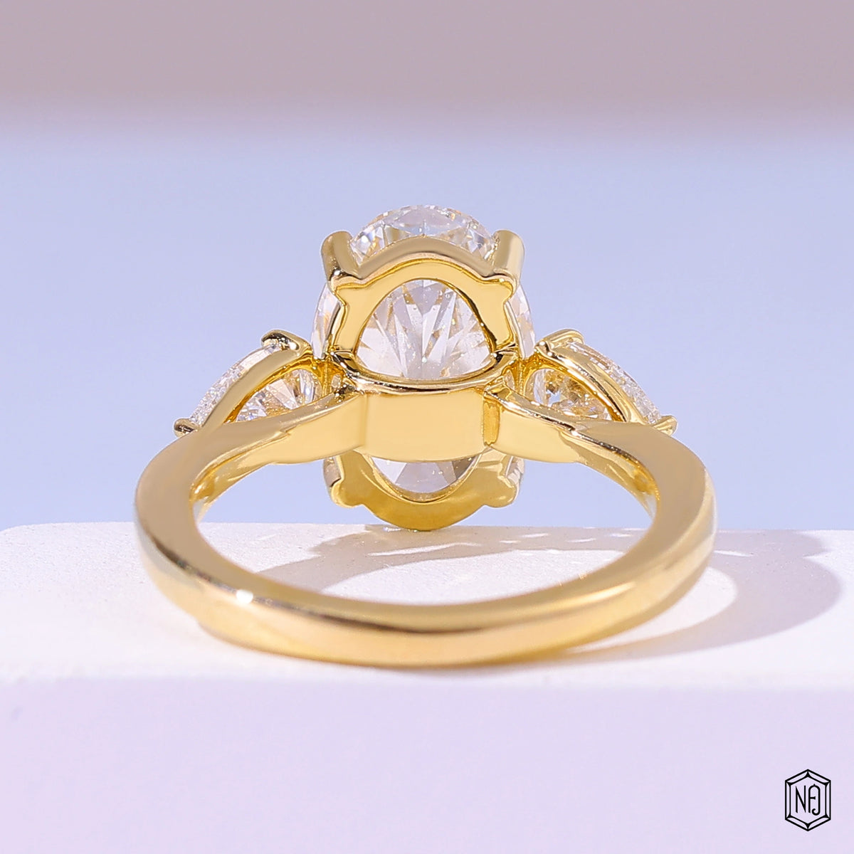 4.06 Carat Oval Cut Lab Grown Diamond Trellis Three-Stone Engagement Ring - Hand View / Detail Angle
