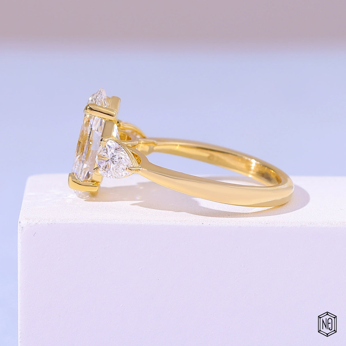 4.06 Carat Oval Cut Lab Grown Diamond Trellis Three-Stone Engagement Ring - Angled Perspective