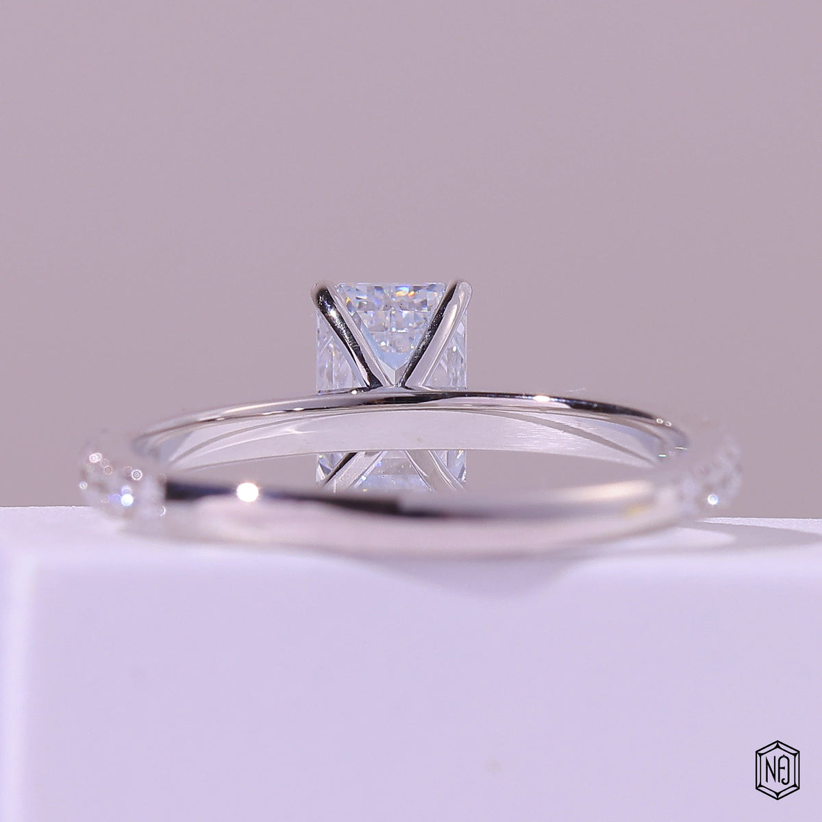 1.47 Carat Emerald Cut Lab Grown Diamond Side Stone Pavé Engagement Ring - Hand View / Detail Angle