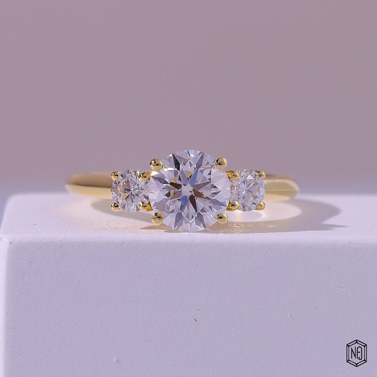1.19 Carat Round Cut Lab Grown Diamond Trellis Three-Stone Engagement Ring - Front Top View