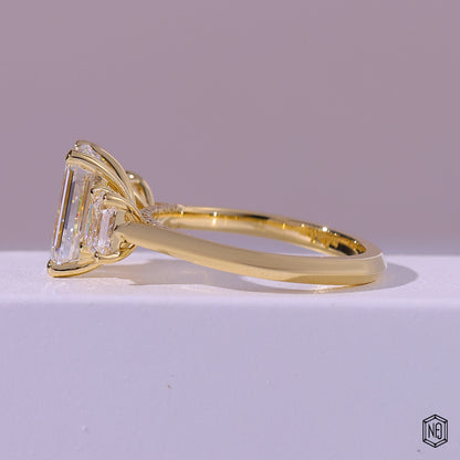 2.99 Carat Emerald Cut Lab Grown Diamond Trellis Three-Stone Engagement Ring - Angled Perspective
