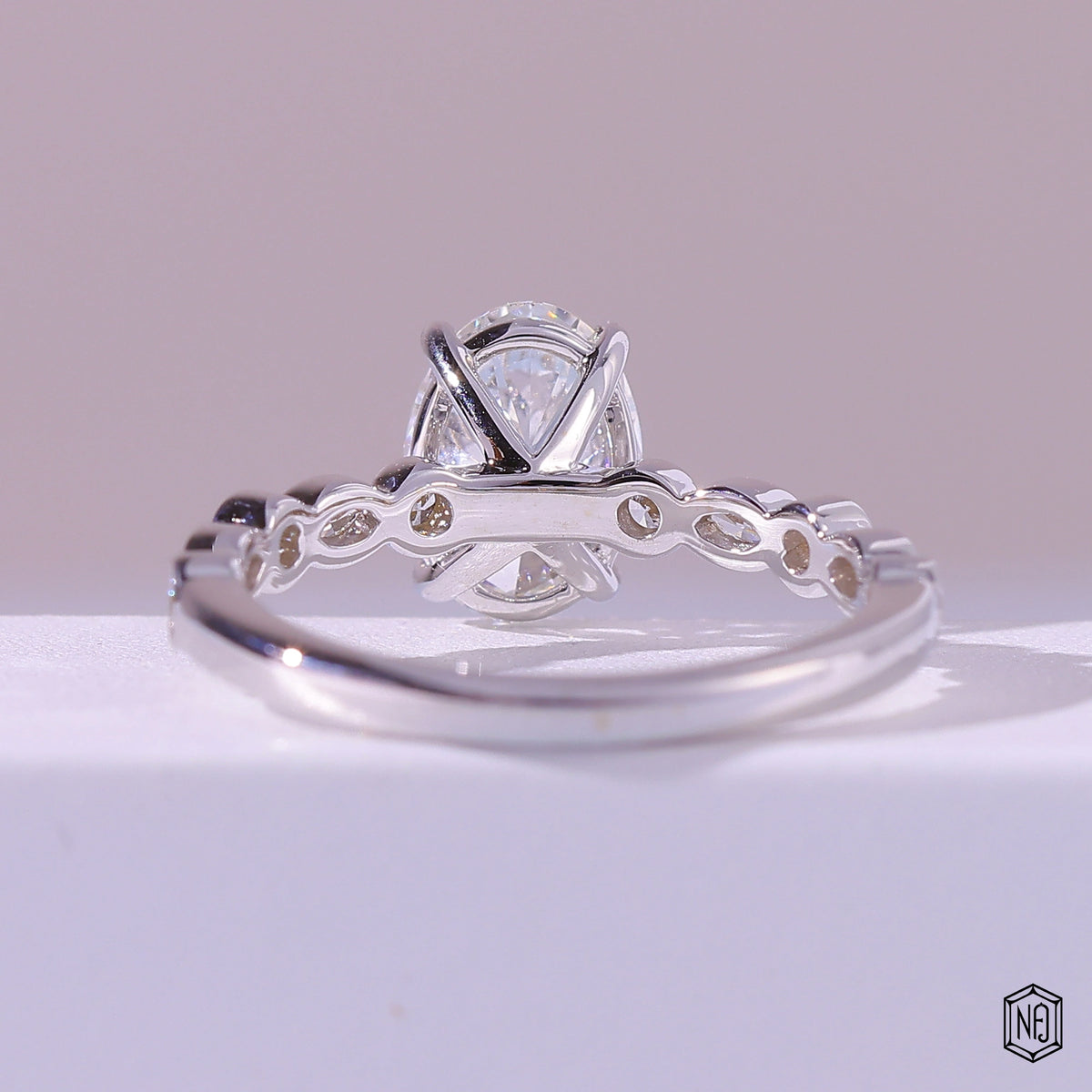 1.58 Carat Oval Cut Lab Grown Diamond Side Stone Pavé Engagement Ring - Hand View / Detail Angle