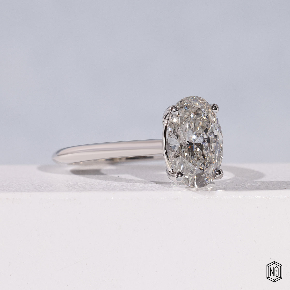 Oval Cut Lab Grown Diamond Solitaire Engagement Ring with 4-Prong Ball Crown