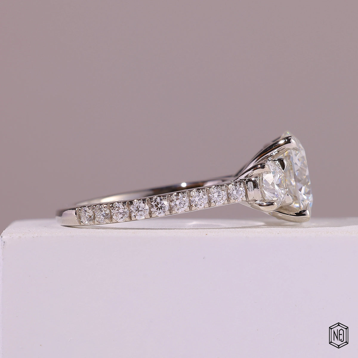 4.09 Carat Round Cut Lab Grown Diamond Trellis Three-Stone Engagement Ring - Side Profile Angle