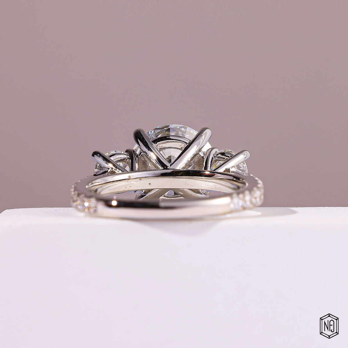 4.09 Carat Round Cut Lab Grown Diamond Trellis Three-Stone Engagement Ring - Hand View / Detail Angle