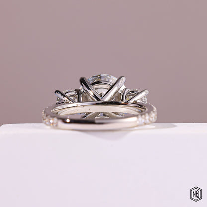 4.09 Carat Round Cut Lab Grown Diamond Trellis Three-Stone Engagement Ring - Hand View / Detail Angle