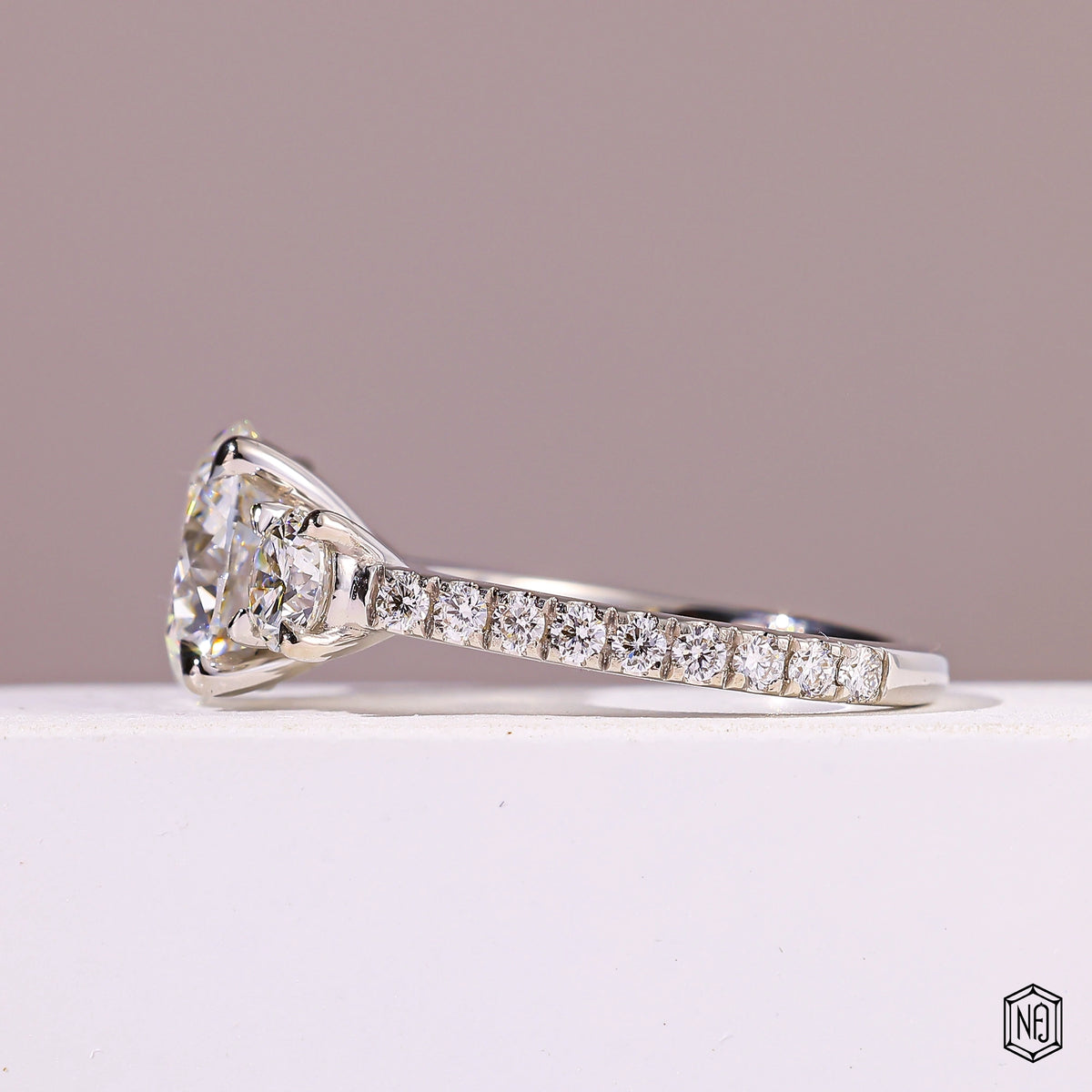 4.09 Carat Round Cut Lab Grown Diamond Trellis Three-Stone Engagement Ring - Angled Perspective