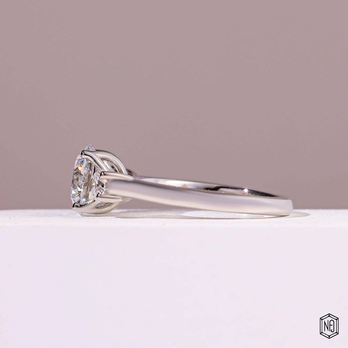 2.08 Carat Round Cut Lab Grown Diamond Trellis Three-Stone Engagement Ring - Angled Perspective