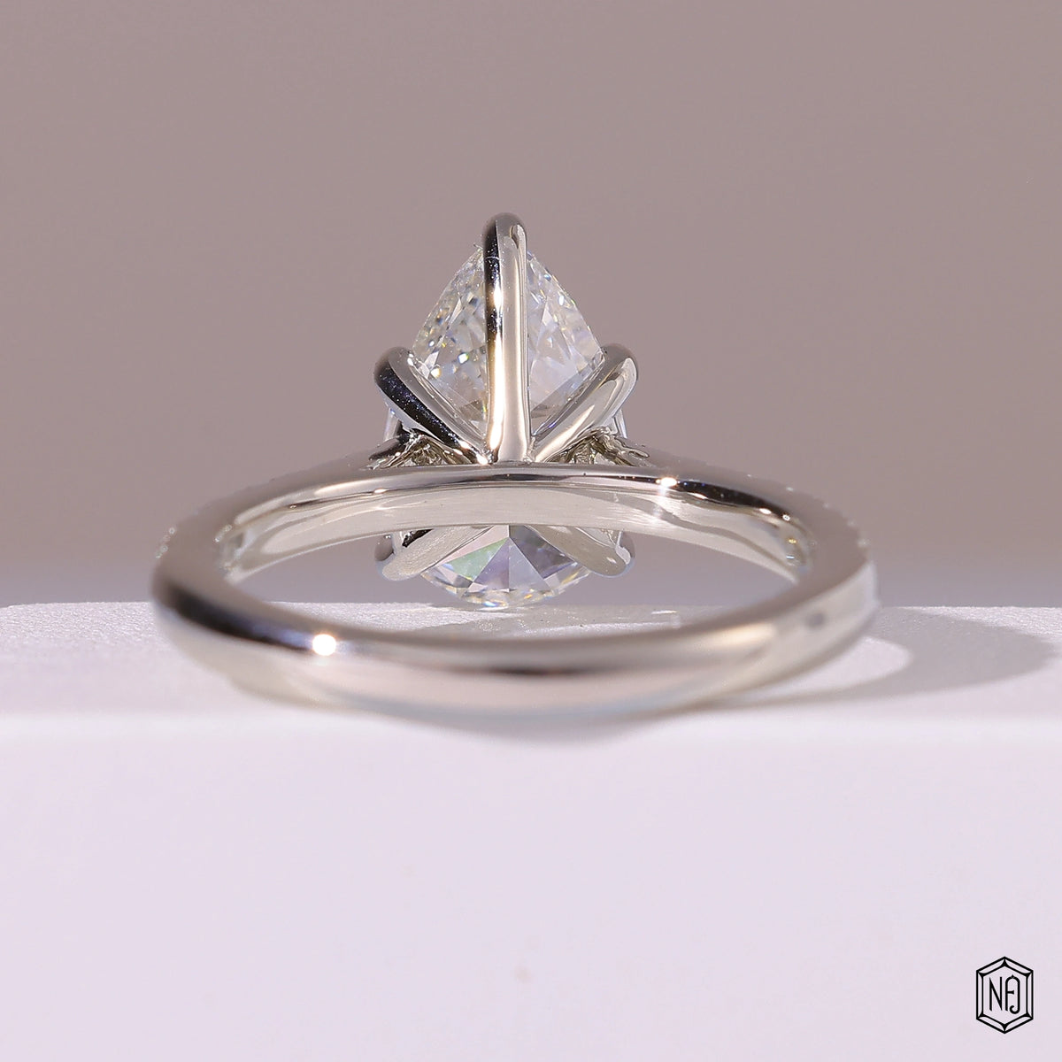 2.29 Carat Pear Cut Lab Grown Diamond Side Stone Pavé Engagement Ring - Hand View / Detail Angle
