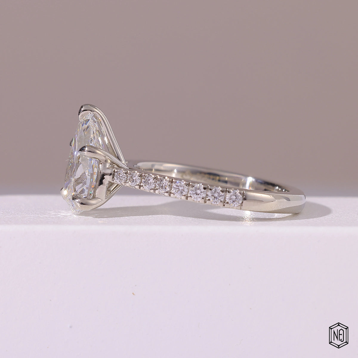 2.29 Carat Pear Cut Lab Grown Diamond Side Stone Pavé Engagement Ring - Angled Perspective