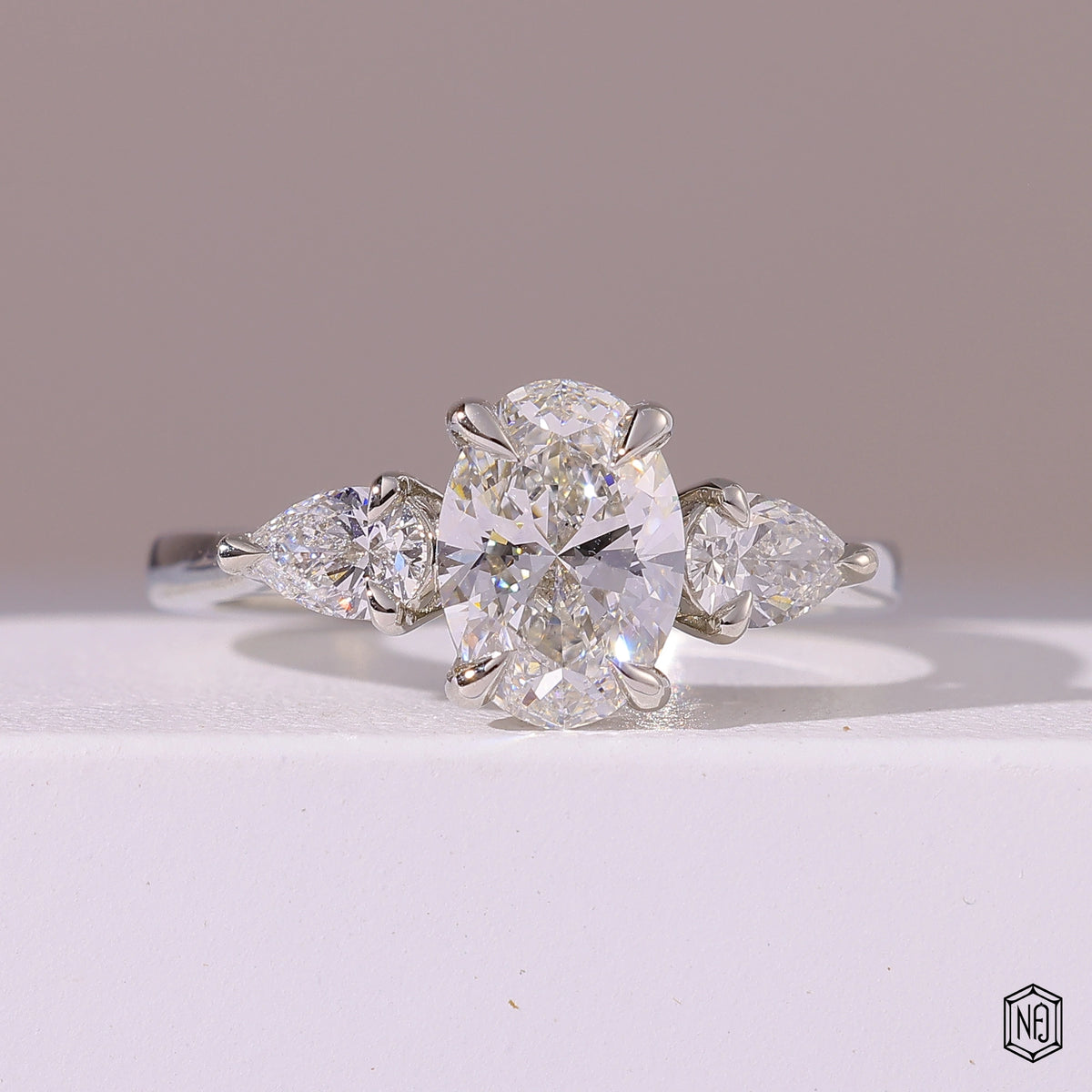 1.5 Carat Oval Cut Lab Grown Diamond Trellis Three-Stone Engagement Ring - Front Top View