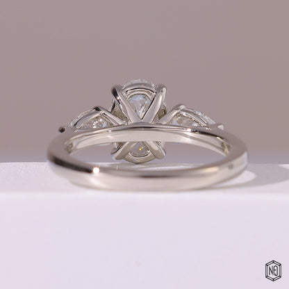 1.5 Carat Oval Cut Lab Grown Diamond Trellis Three-Stone Engagement Ring - Hand View / Detail Angle