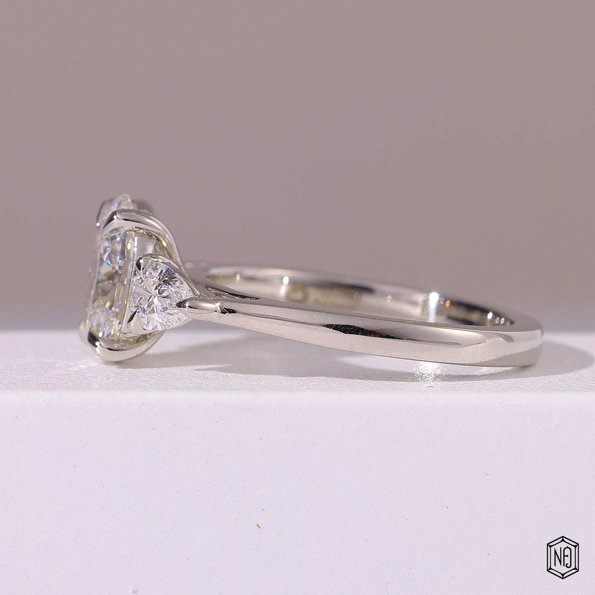 1.5 Carat Oval Cut Lab Grown Diamond Trellis Three-Stone Engagement Ring - Angled Perspective