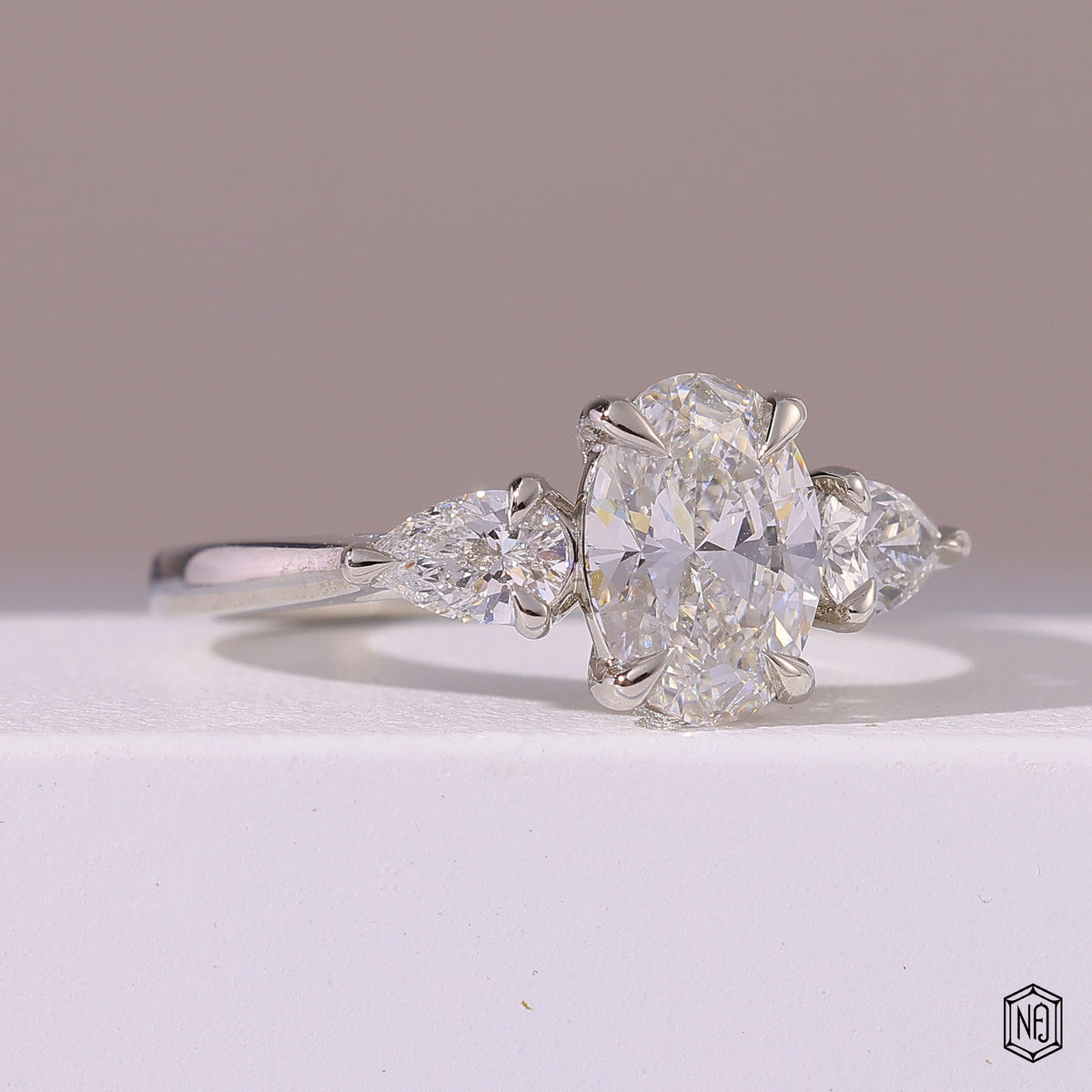 1.5 Carat Oval Cut Lab Grown Diamond Trellis Three-Stone Engagement Ring - Gallery & Prongs Detail
