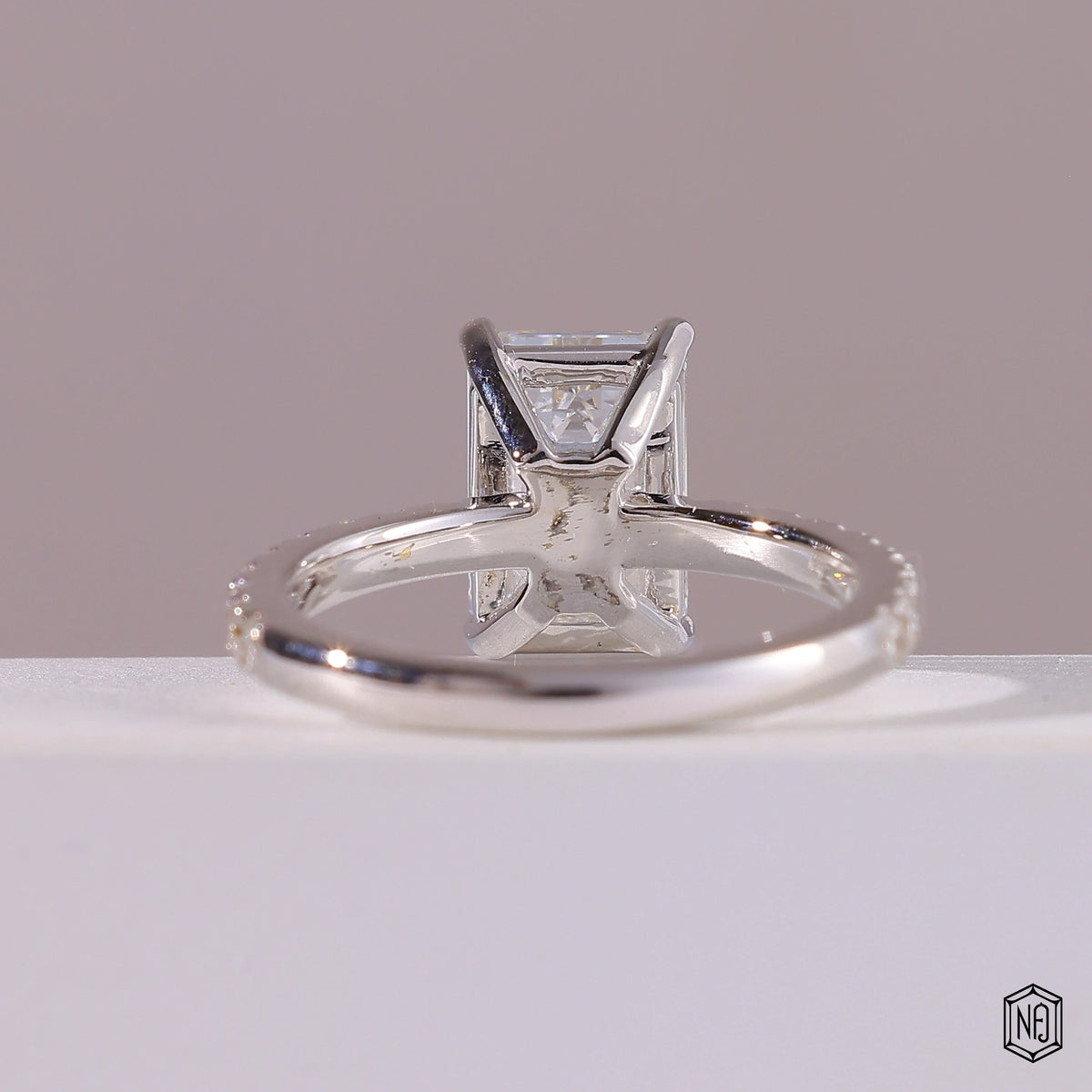 2.76 Carat Emerald Cut Lab Grown Diamond Side Stone Pavé Engagement Ring - Hand View / Detail Angle
