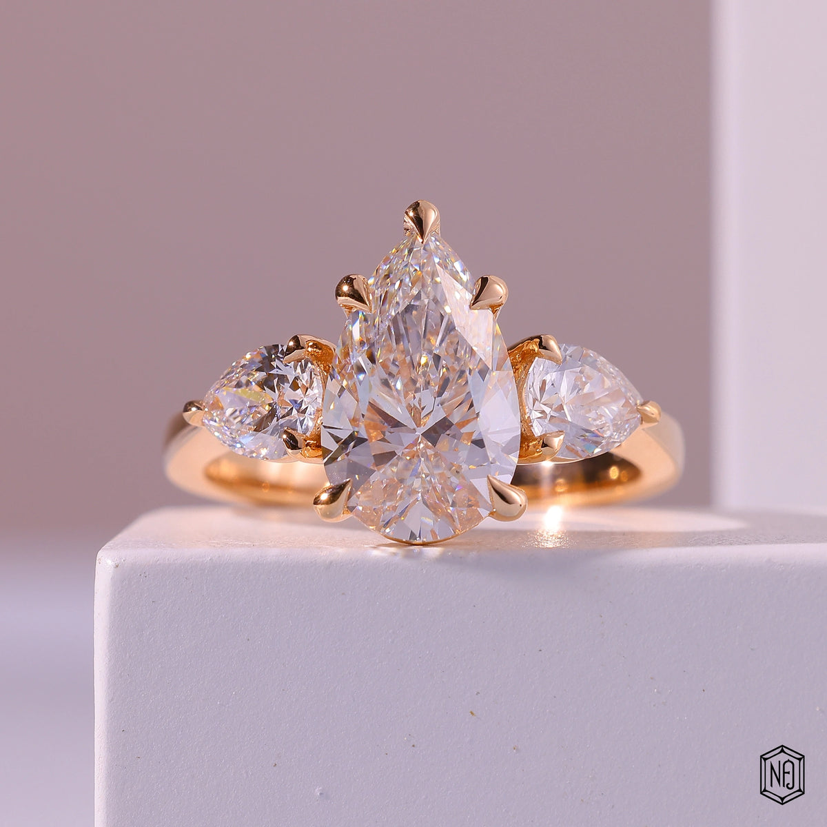 4.01 Carat Pear Cut Lab Grown Diamond Trellis Three-Stone Engagement Ring - Front Top View