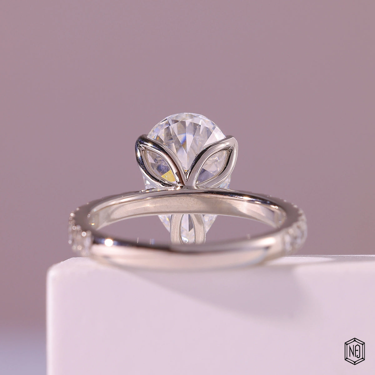 3.71 Carat Pear Cut Lab Grown Diamond Side Stone Pavé Engagement Ring - Hand View / Detail Angle
