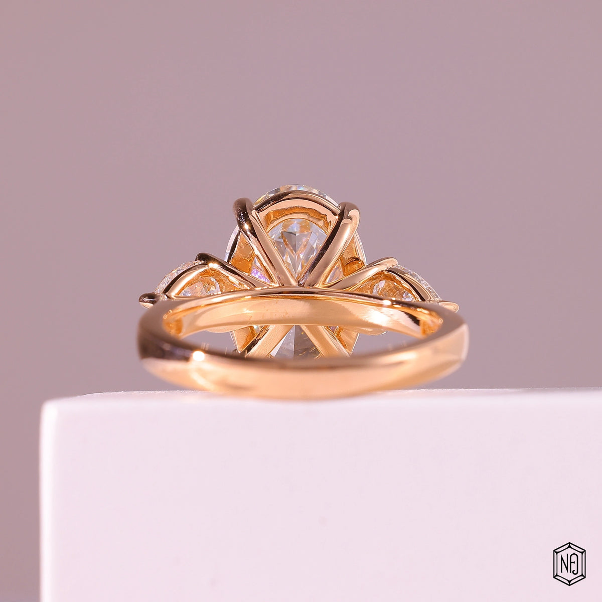 4.03 Carat Oval Cut Lab Grown Diamond Trellis Three-Stone Engagement Ring - Hand View / Detail Angle