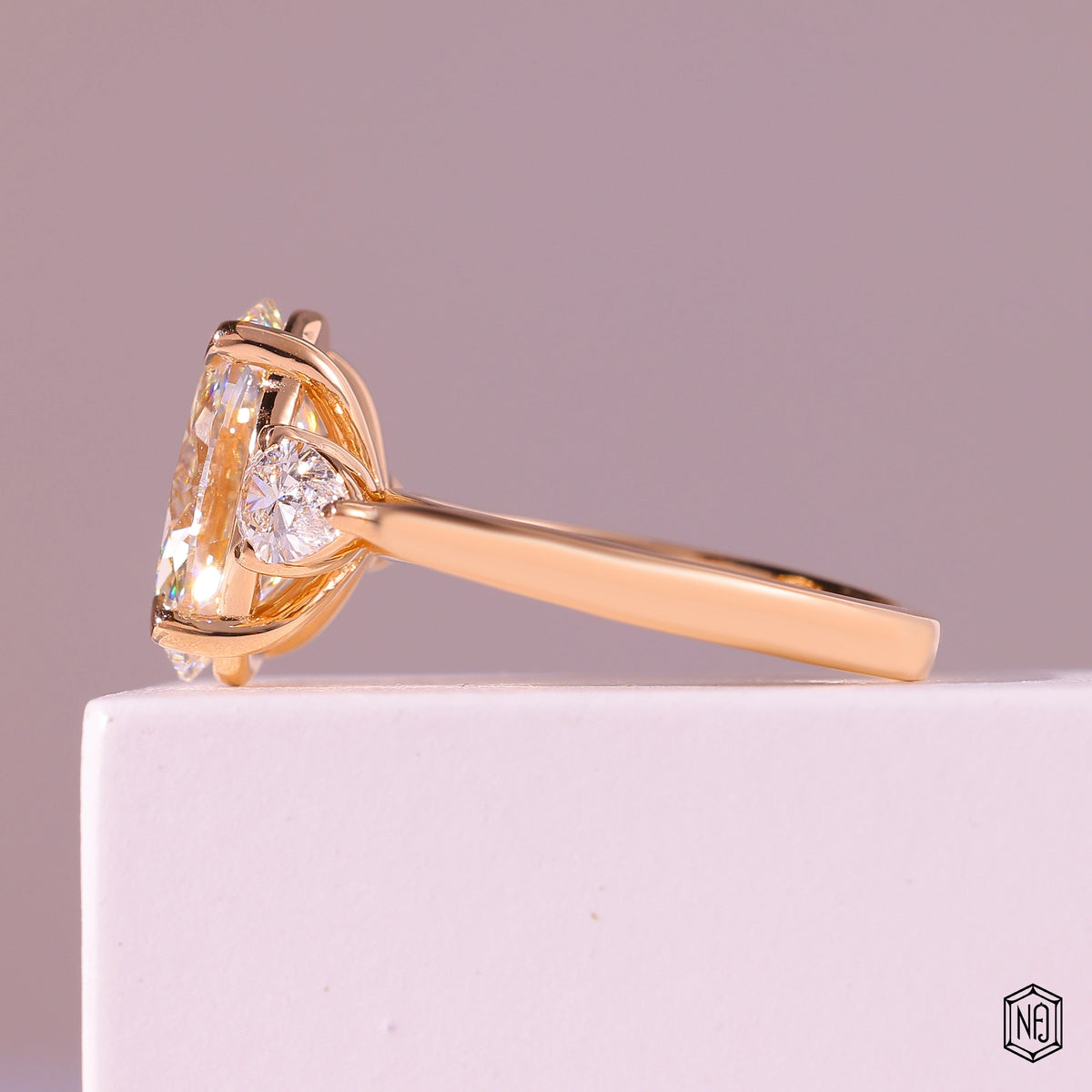 4.03 Carat Oval Cut Lab Grown Diamond Trellis Three-Stone Engagement Ring - Angled Perspective