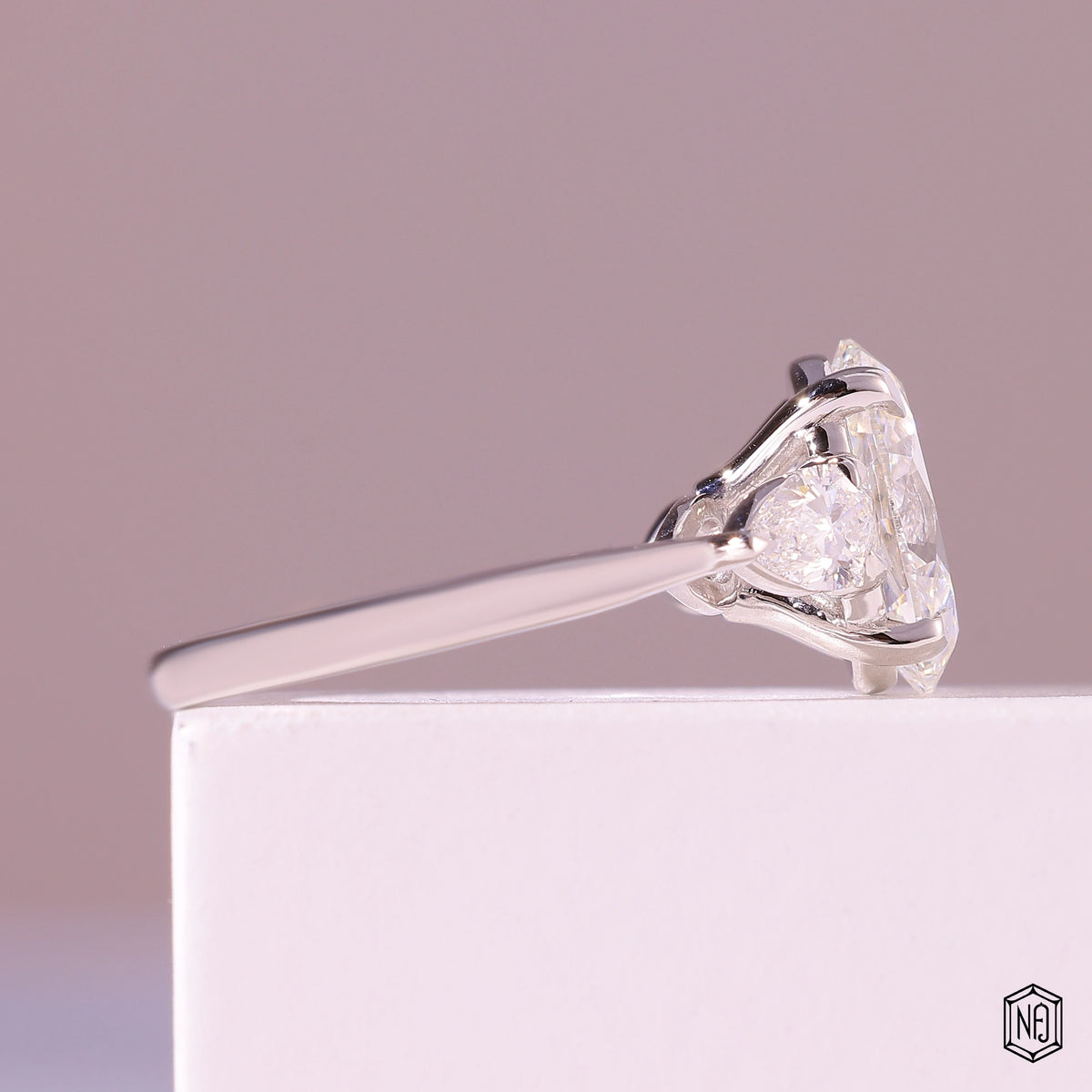 3.19 Carat Oval Cut Lab Grown Diamond Trellis Three-Stone Engagement Ring - Side Profile Angle