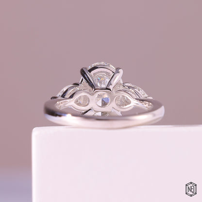 3.19 Carat Oval Cut Lab Grown Diamond Trellis Three-Stone Engagement Ring - Hand View / Detail Angle
